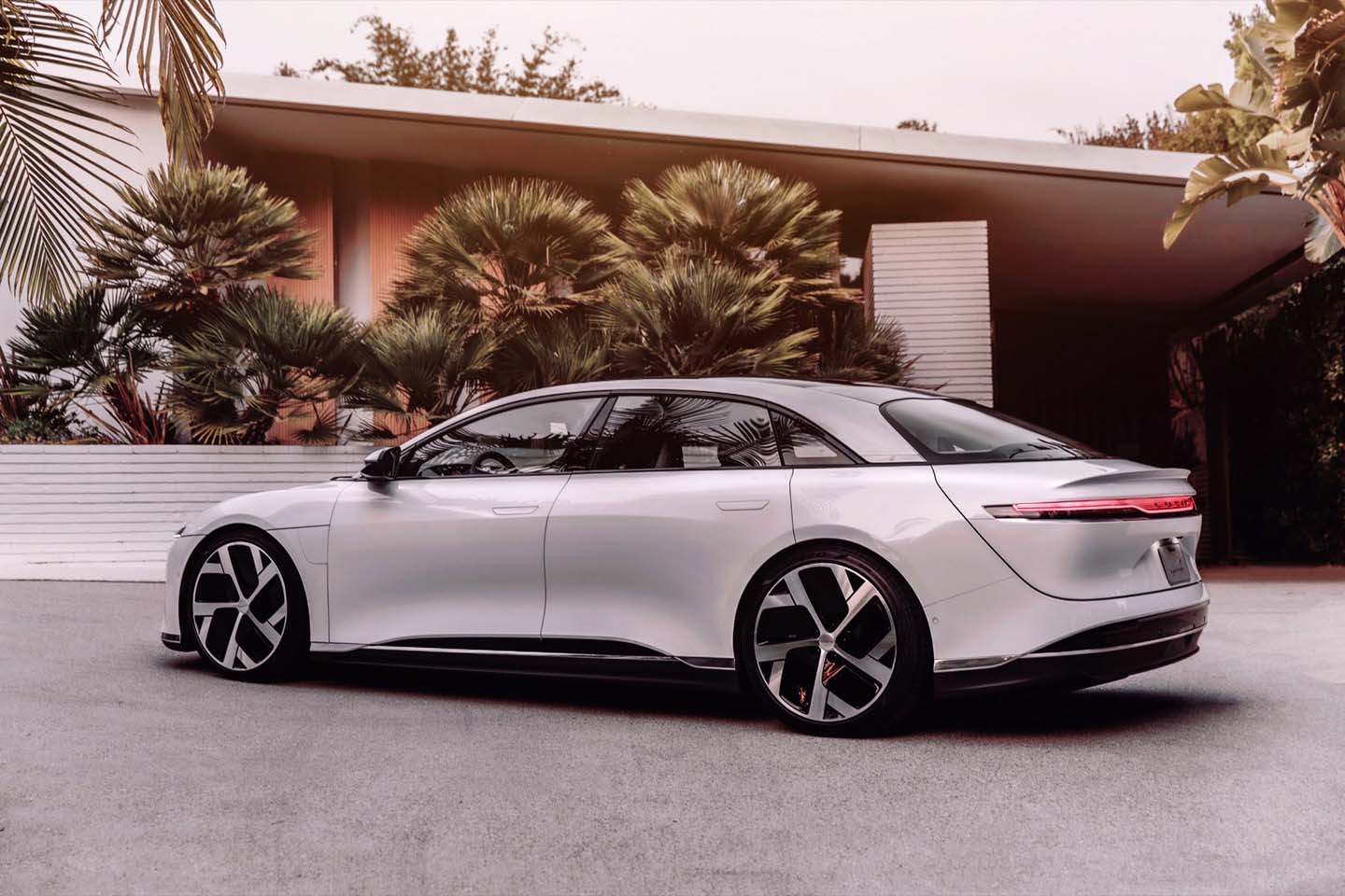 lucid air white rear parked in driveway