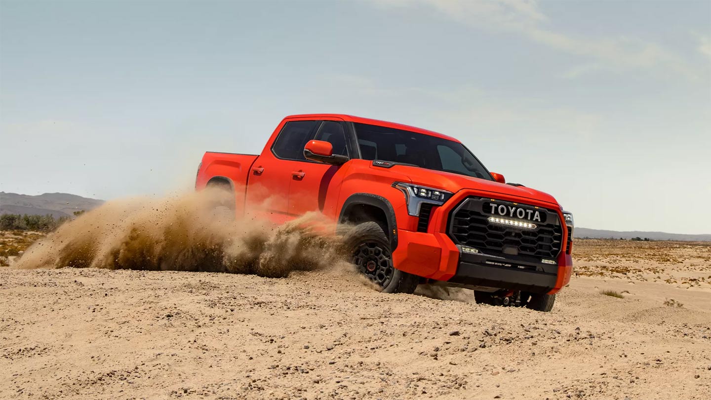 2022 Toyota Tundra TRD Pro in Orange Driving Through Dirt